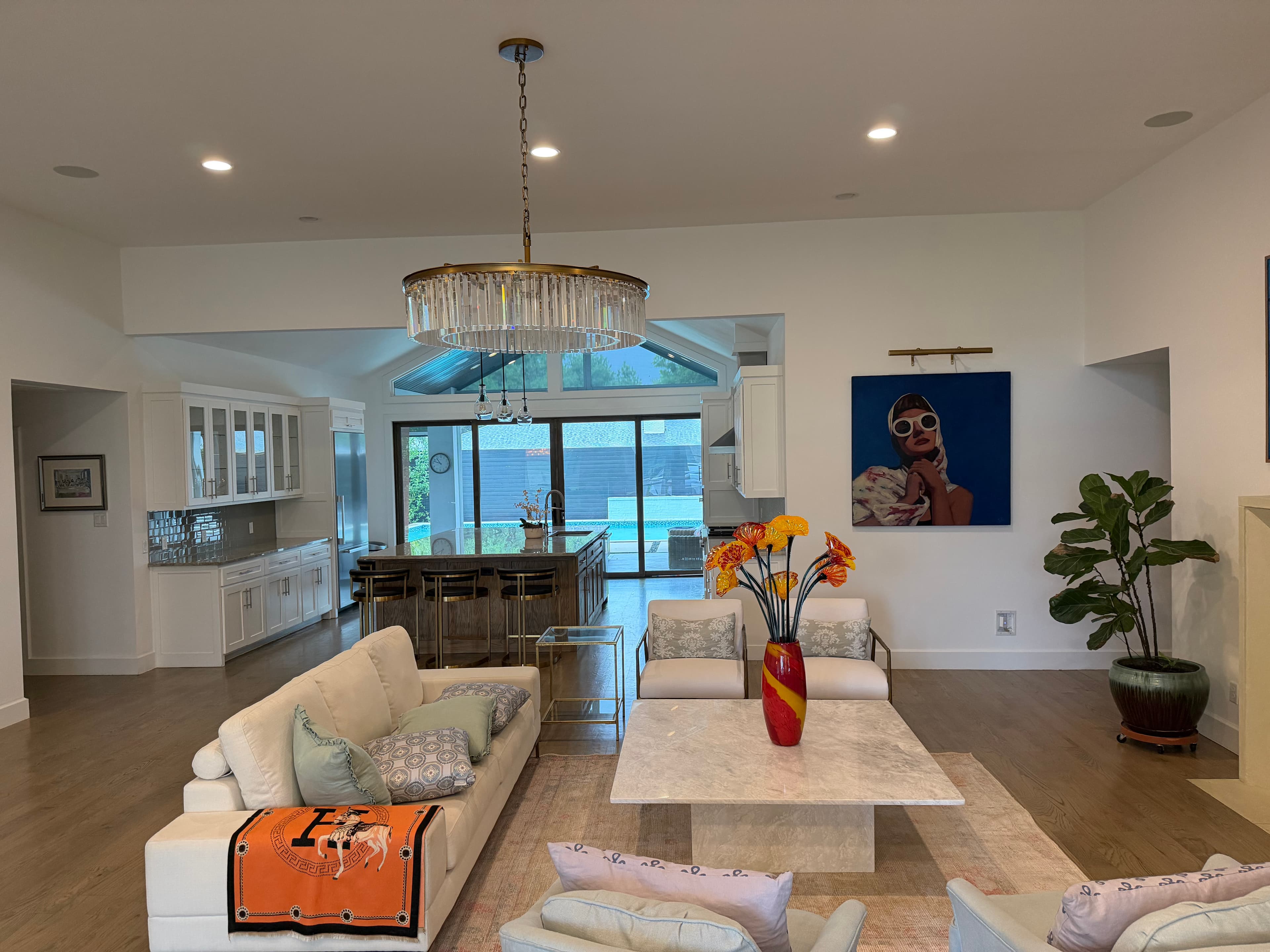 Open concept great room flowing into the kitchen with vaulted ceilings